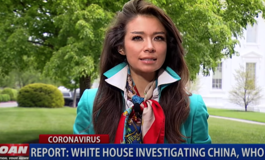 Chanel Rion reporting in front of the White House.