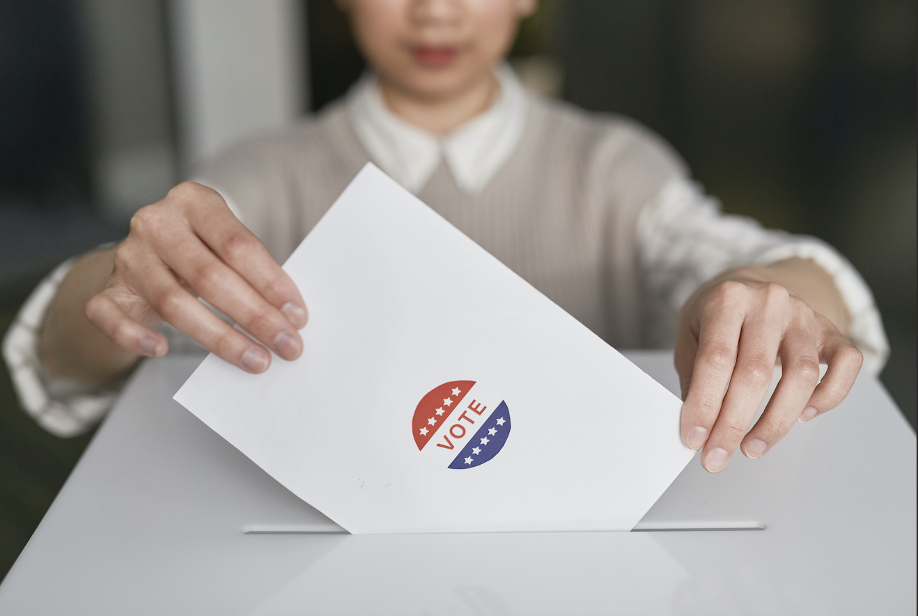 A voter submitting their ballot.